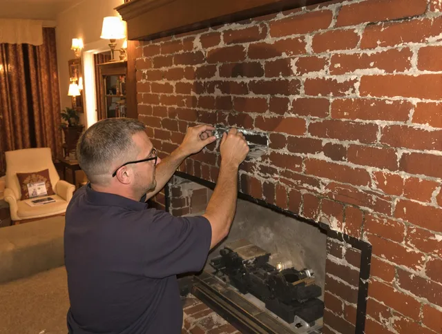 Bradenton Chimney Sweep expert fixing a fireplace in Bradenton, FL